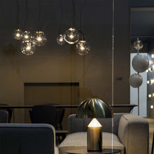Load image into Gallery viewer, The Globe Pendant Light in living room.