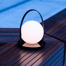 Load image into Gallery viewer, Bola Outdoor LED Lantern in Outside Area.
