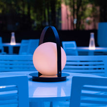 Load image into Gallery viewer, Bola Outdoor LED Lantern in Outside Area.