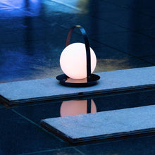 Load image into Gallery viewer, Bola Outdoor LED Lantern in Outside Area.
