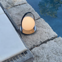 Load image into Gallery viewer, Bola Outdoor LED Lantern in Outside Area.