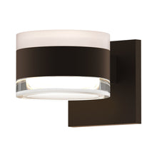 Load image into Gallery viewer, Reals Up/Down Outdoor LED Wall Light in Textured Bronze/White Cylinder Lens/Clear Cylinder Lens.