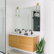 Load image into Gallery viewer, Rousseau Wall Light in bathroom.