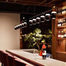 Load image into Gallery viewer, Ling LED Linear Pendant Light in restaurant.