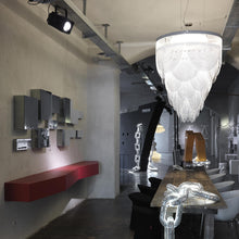 Load image into Gallery viewer, Ceremony LED Chandelier in living room.
