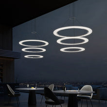 Load image into Gallery viewer, Arctic Rings™ Triple Ring LED Pendant Light in restaurant.
