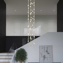 Load image into Gallery viewer, Constellation® Andromeda Round LED Pendant Light in living room.