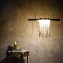 Load image into Gallery viewer, Trapeze LED Linear Pendant light in living room.