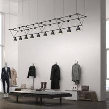 Load image into Gallery viewer, Suspenders® Triangle Truss Linear LED Suspension Light in room.