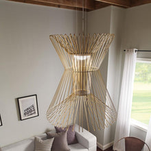 Load image into Gallery viewer, Syrma Grande LED Pendant Light in living room.