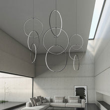 Load image into Gallery viewer, Torc™ LED Pendant Light in living room.