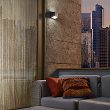Load image into Gallery viewer, Ebb Outdoor LED Wall Light in living room.