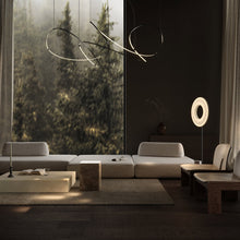 Load image into Gallery viewer, Iris LED Floor Lamp in living room.
