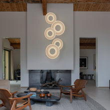 Load image into Gallery viewer, Iris LED Pendant Light in living room.
