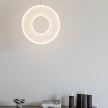 Load image into Gallery viewer, Iris LED Pendant Light in living room.

