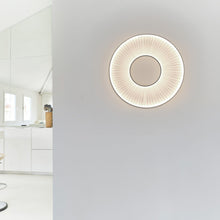 Load image into Gallery viewer, Iris LED Wall Light in living room.
