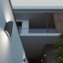 Load image into Gallery viewer, Remy Outdoor LED Wall Light in Outside Area.
