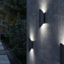 Load image into Gallery viewer, Remy Outdoor LED Wall Light in Outside Area.
