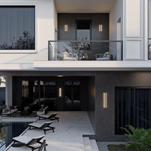 Load image into Gallery viewer, Rhea Outdoor LED Wall Light in Outside Area.

