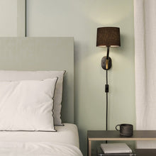 Load image into Gallery viewer, Arbor Plug-In Wall Light in bedroom.
