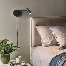 Load image into Gallery viewer, Ascoli Swing Plug-In Wall Light in bedroom.

