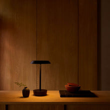 Load image into Gallery viewer, Halo LED Portable Table Lamp in living room.
