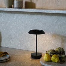 Load image into Gallery viewer, Halo LED Portable Table Lamp in living room.

