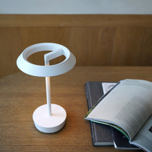 Load image into Gallery viewer, Halo LED Portable Table Lamp in living room.
