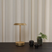 Load image into Gallery viewer, Halo LED Portable Table Lamp in living room.
