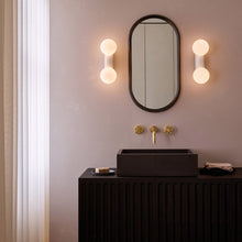 Load image into Gallery viewer, Lyra Bath Wall Light in bathroom.
