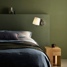 Load image into Gallery viewer, Mitsu LED Swing Arm Wall Light in bedroom.
