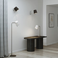 Load image into Gallery viewer, Mitsu LED Swing Arm Wall Light in living room.
