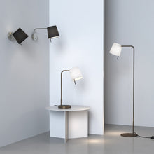 Load image into Gallery viewer, Mitsu LED Swing Arm Wall Light in living room.
