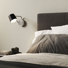Load image into Gallery viewer, Miura LED Swing Arm Wall Light in bedroom.

