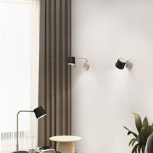 Load image into Gallery viewer, Miura LED Swing Arm Wall Light in living room.
