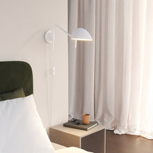 Load image into Gallery viewer, Serge Plug-In Wall Light in bedroom.
