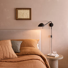 Load image into Gallery viewer, Serge Plug-In Wall Light in bedroom.
