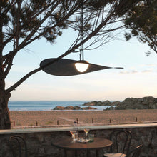 Load image into Gallery viewer, Bloom Outdoor LED Pendant Light in Outside Area.
