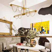 Load image into Gallery viewer, Lariat LED Chandelier in living room.
