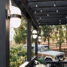 Load image into Gallery viewer, Capsule Outdoor Wall Light in Outside Area.
