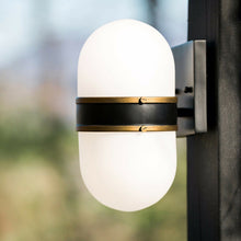 Load image into Gallery viewer, Capsule Outdoor Wall Light in Outside Area.
