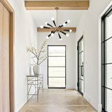 Load image into Gallery viewer, Zodiac Chandelier in hallway.
