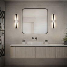 Load image into Gallery viewer, Enigmatic LED Vanity Wall Light in bathroom.
