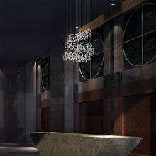 Load image into Gallery viewer, Vornado LED Multi Pendant Light in living room.
