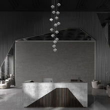 Load image into Gallery viewer, Whirl LED Multi Pendant Light in living room.
