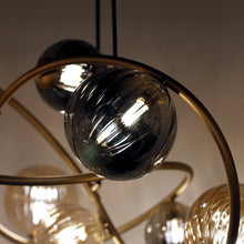 Load image into Gallery viewer, Planetary Chandelier in Detail.
