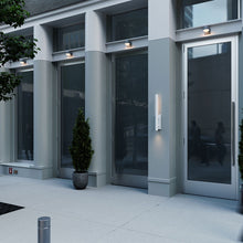 Load image into Gallery viewer, Flue™ Outdoor LED Wall Light in Outside Area.

