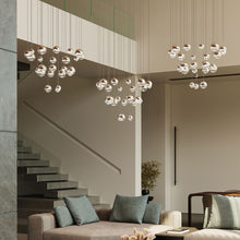 Load image into Gallery viewer, Grapes® 24-Light Round LED Multipoint Pendant Light in living room.
