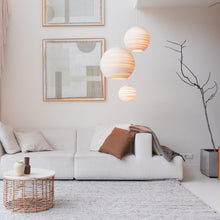 Load image into Gallery viewer, Moon Pendant Light in living room.
