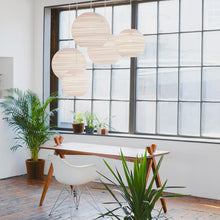 Load image into Gallery viewer, Moon Pendant Light in living room.
